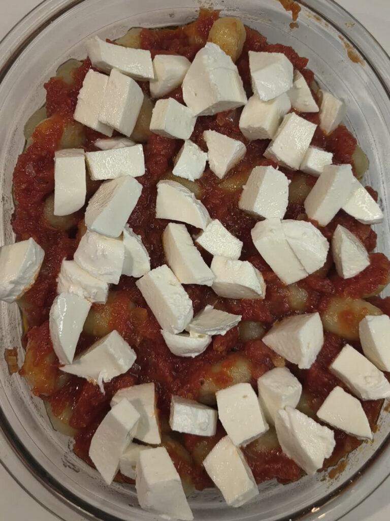 baking dish with gnocchi alla sorrentina before going into the oven