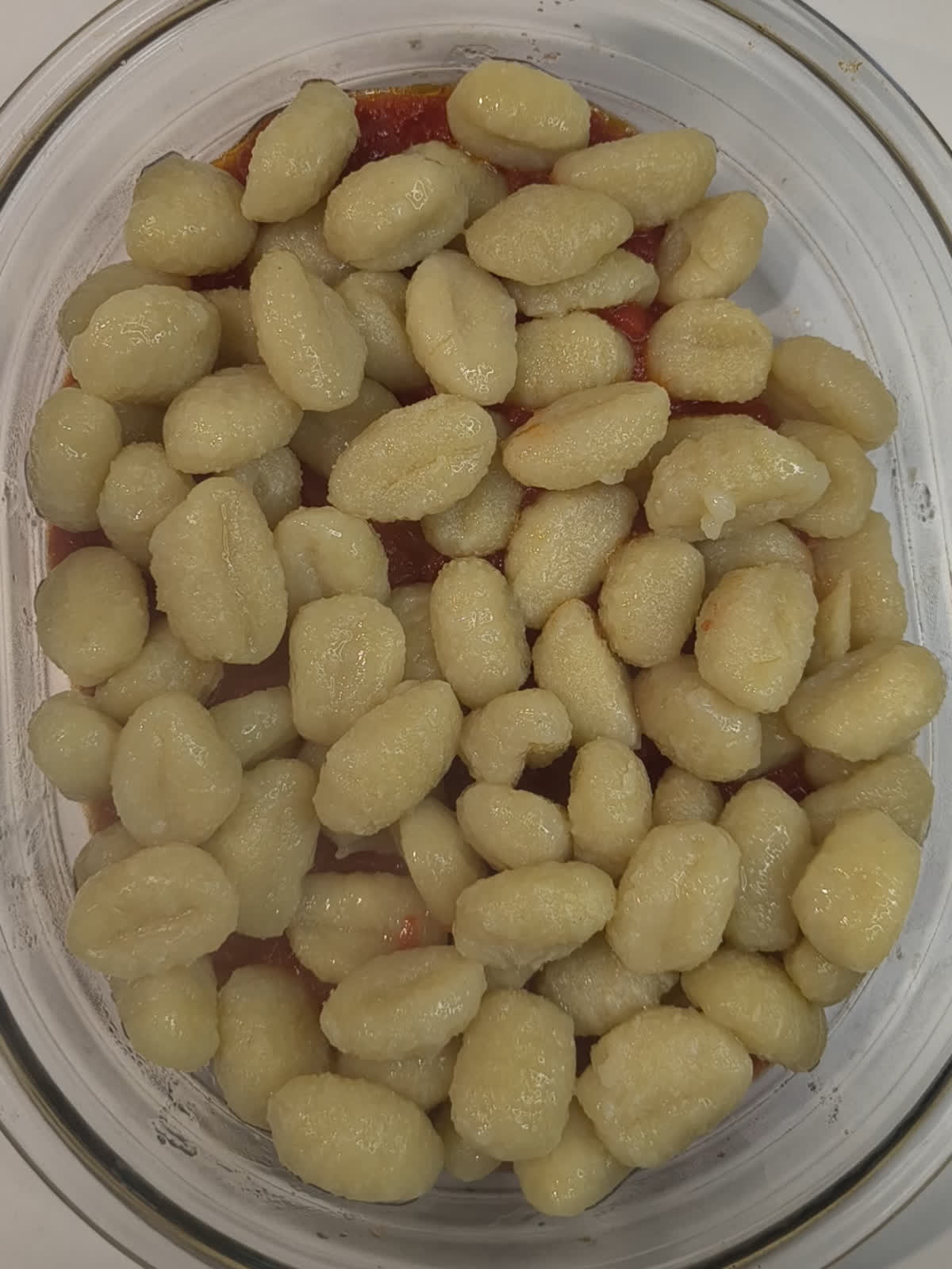 gnocchi with sauce in baking dish