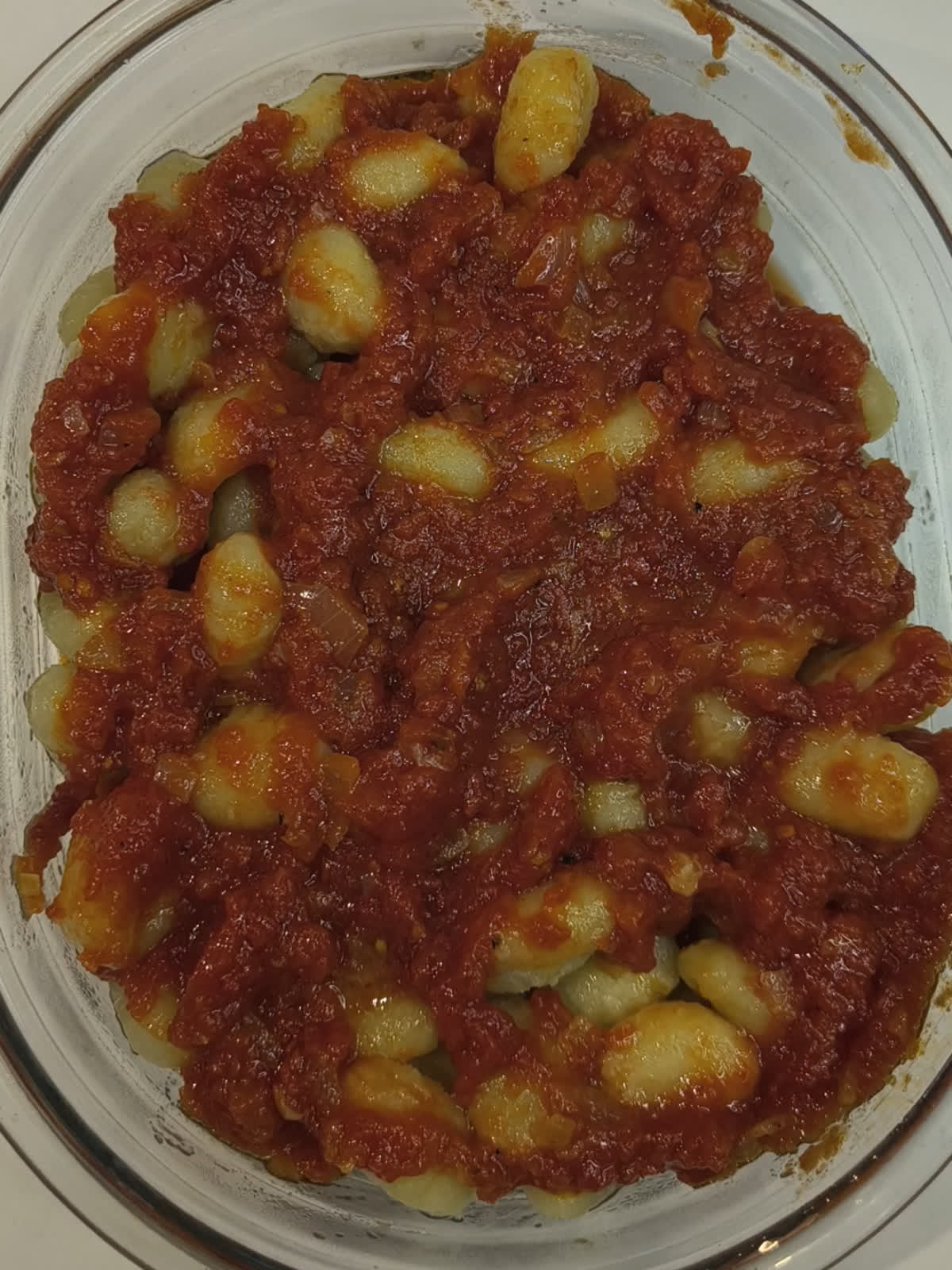 gnocchi just covered with chopped tomatoes