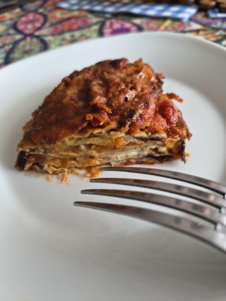 inside of aubergine parmigiana with layers of aubergine, tomato, and cheese